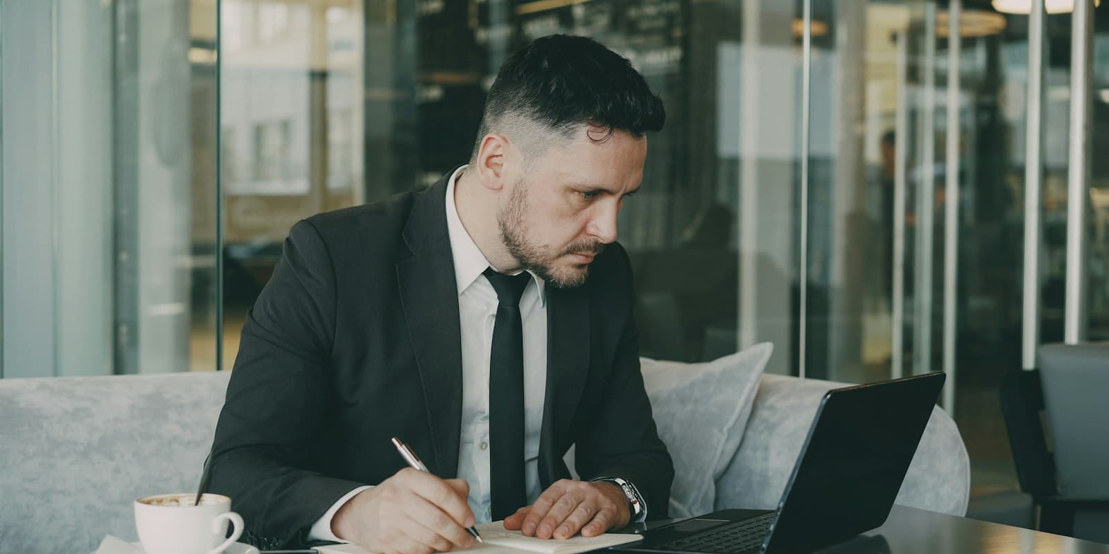 Business owner reviewing plan details and taking notes